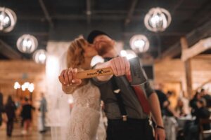 Newlywed couple holds a custom axe